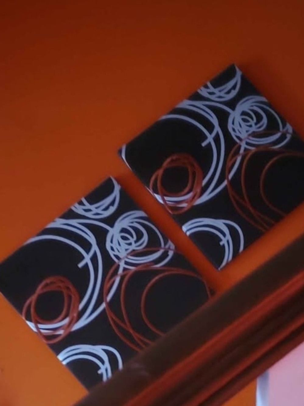 Wall Art with Orange & White Circular Swirl Design